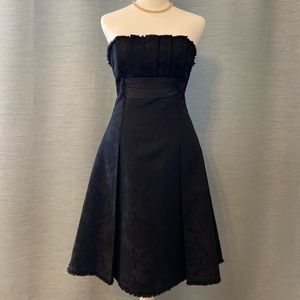 BCBGMAXAZRIA Black Strapless MIDI Cocktail dress with a bow on the back!